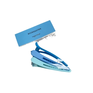 Set of three matte blue gradient hair clips with hollow design on display card