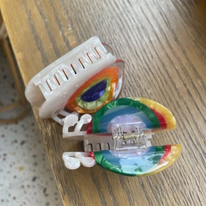 Cute snail acetate hair claw clips in milky white and rainbow colors for women
