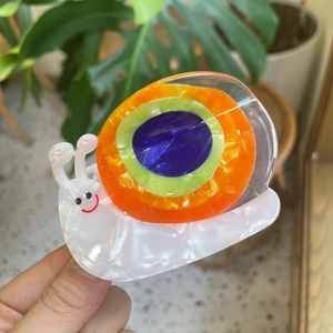 Cute snail-shaped acetate hair claw clip with colorful marble pattern for women