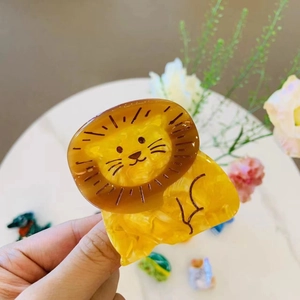 Cute acetate lion hair claw clip in amber yellow with marbled texture for women