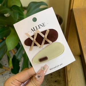 Elegant bow ribbon hair clips set on display card with minimalist aesthetic