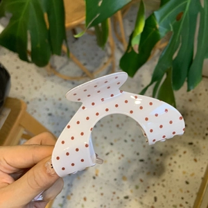 Elegant acrylic hair claw clip with red polka dots on white base for women