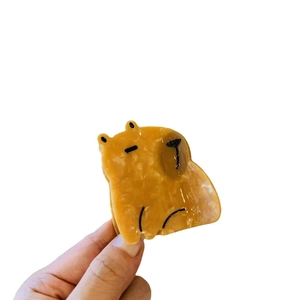 Acetate hair claw clip featuring a cute capybara animal design with marble texture finish