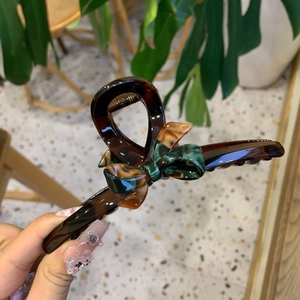 Tortoise shell resin hair claw clip with vintage dark green and amber bow detail