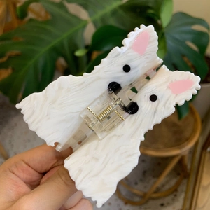 Pearlescent white acetate dog hair claw clip in Westie design with gold spring detail