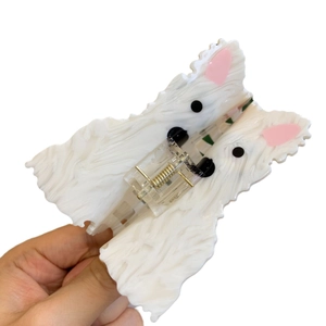 White Westie dog acetate hair claw clip with pink ear details and a golden spring mechanism