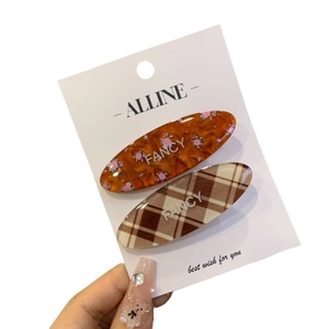 Floral and checkered acrylic hair clips set with Fancy text on white display card
