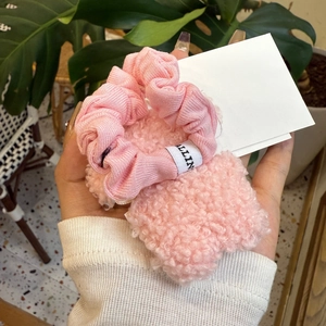 Pink plush scrunchies set featuring soft faux fur and fabric textures with Allin tag