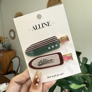 Set of two vintage checkered hair clips with rhinestones and Alline logo on card