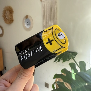Creative battery-shaped acetate hair claw with Stay Positive text for high ponytail