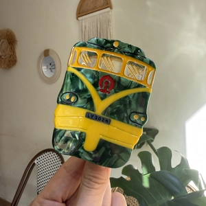 Green marble acetate hair claw clip in a cute retro bus design with yellow details