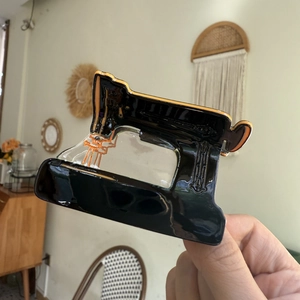 Unique sewing machine shaped acetate hair claw clip in black and orange for women