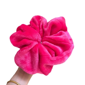 Plush hot pink velvet oversized scrunchie with soft ruched texture for hair styling