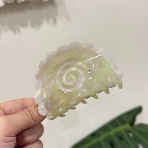 Green marble acetate hair claw clip with spiral sun flower pattern and rhinestone