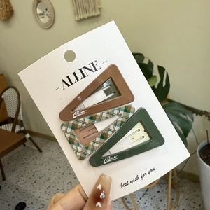 Three-piece geometric triangular hair clips set in brown, plaid, and green colors