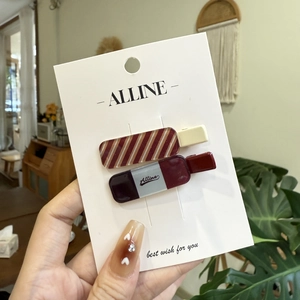 Plaid and striped school style bow duckbill hair clips set on a white branded display card