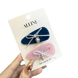 Pink and navy blue matte bow hair clips with heart charms for girls, two-piece accessory set