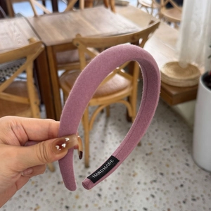 Detail of lavender padded headband showing high-quality fabric texture and Hand Made label