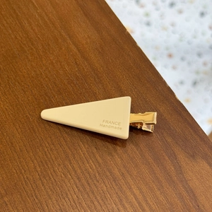 Minimalist cream triangular hair clip with gold metal base and France Handmade text