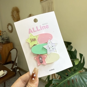 Three-piece set of star-shaped hair clips with animal motifs on colorful duckbill bases
