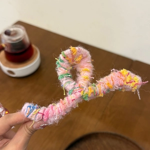 Pink wave hair claw clip wrapped in colorful knitted wool yarn for autumn and winter