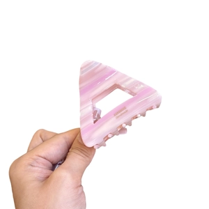 Pink marble pattern triangular hair claw clip with gold lettering for high ponytail