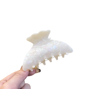 Thick acetate shark hair claw clip in pearlescent white marble for elegant women hair styling