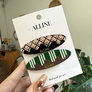 Sweet vintage checkered and striped wavy hair clips set on a display card for women