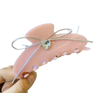 Pink acetate hair claw clip with silver ribbon bow and crystal heart charm