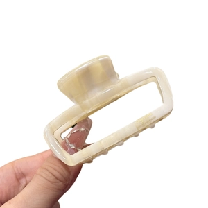 Chic cream marble acetate claw clip with gold Barrette France logo for women hair styling