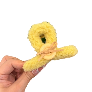 Teddy plush shark hair claw clip in light yellow with bow and button detail