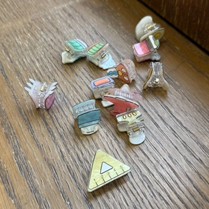 Detailed close-up of mini Y2K acrylic hair clips with colorful patterns and school motifs