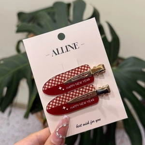 Barrettes à cheveux à carreaux rouges Happy New Year avec détails d'étoiles sur carte