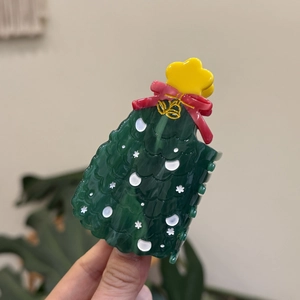 Pince à cheveux sapin de Noël vert avec motifs flocons et détail nœud papillon rouge