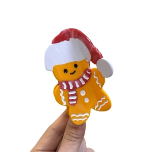 Pince à cheveux bonhomme de pain d'épices avec écharpe rouge rayée et chapeau de Noël