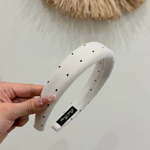 Padded white headband with black polka dots and thickened fabric for high volume style