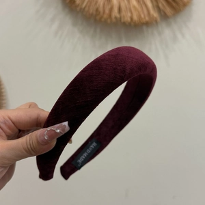 Burgundy corduroy padded headband with high top design and handmade woven label
