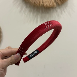 Handcrafted red velvet headband with silver rhinestone star pattern for festive hair styling