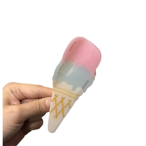 Colorful ice cream shaped acetate hair claw clip with pink and blue cream cone design