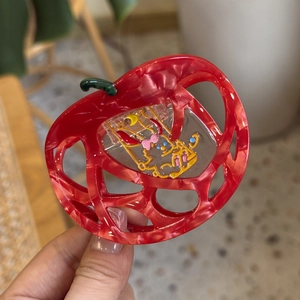 Red apple-shaped acetate hair claw clip with marble texture and cute rabbit design