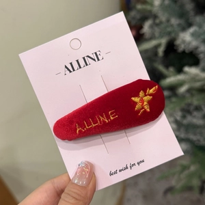 Festive red velvet hair clip with gold ALLINE embroidery for New Year celebrations