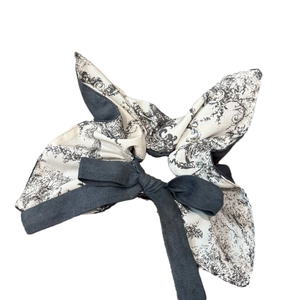 Elegant oversized two-tone scrunchie with a large bow in vintage pattern and dark grey fabric