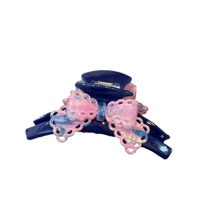 Elegant navy acetate hair claw clip with pink and blue gradient marble lace bow