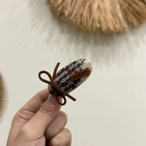 Plaid hair clip with a brown rope bow and a sweet love leather tag on a fabric band