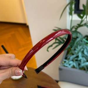 Deep red glossy PU leather headband with high-shine finish and anti-slip lining design