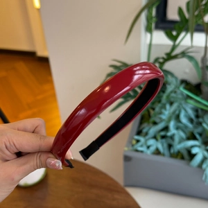 Classic deep red PU leather headband with glossy finish and non-slip lining