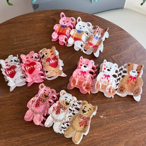 Charming acrylic hair claws with bear and dog designs featuring a soft pearlescent finish