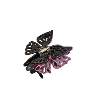 Elegant double-layered butterfly hair claw clip with cutout patterns and gold spring
