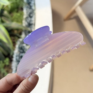 Detailed close-up of large gradient purple acetate hair claw clip with seven sturdy teeth