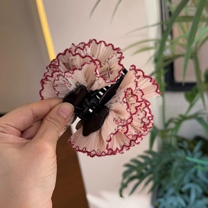 Floral multilayer fabric hair claw clip with pink petal patterns and scalloped red edges